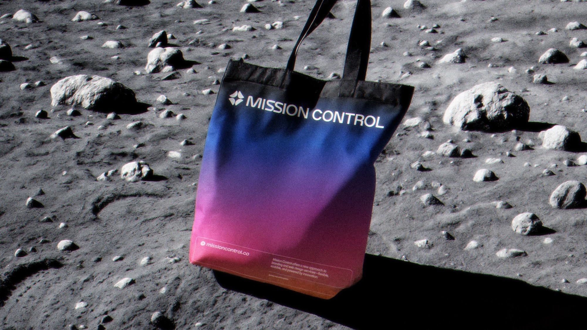Mission Control gradient tote bag above rocky lunar terrain