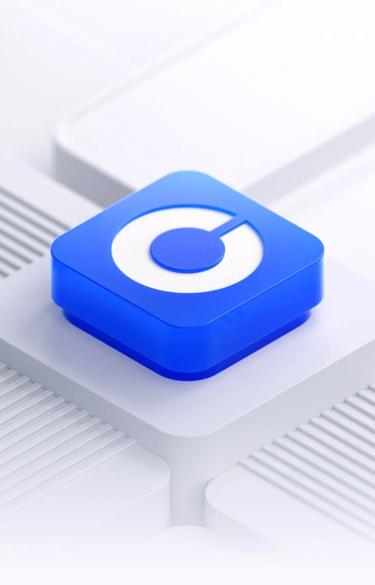A blue Coinbase app icon on a white geometric surface